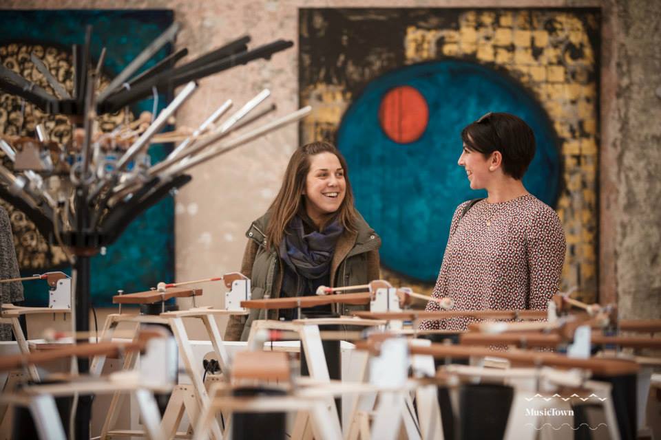 Two women having a laugh playing Dodeca Cycle, a sound installation made by Irish artist and designer Ed Devane